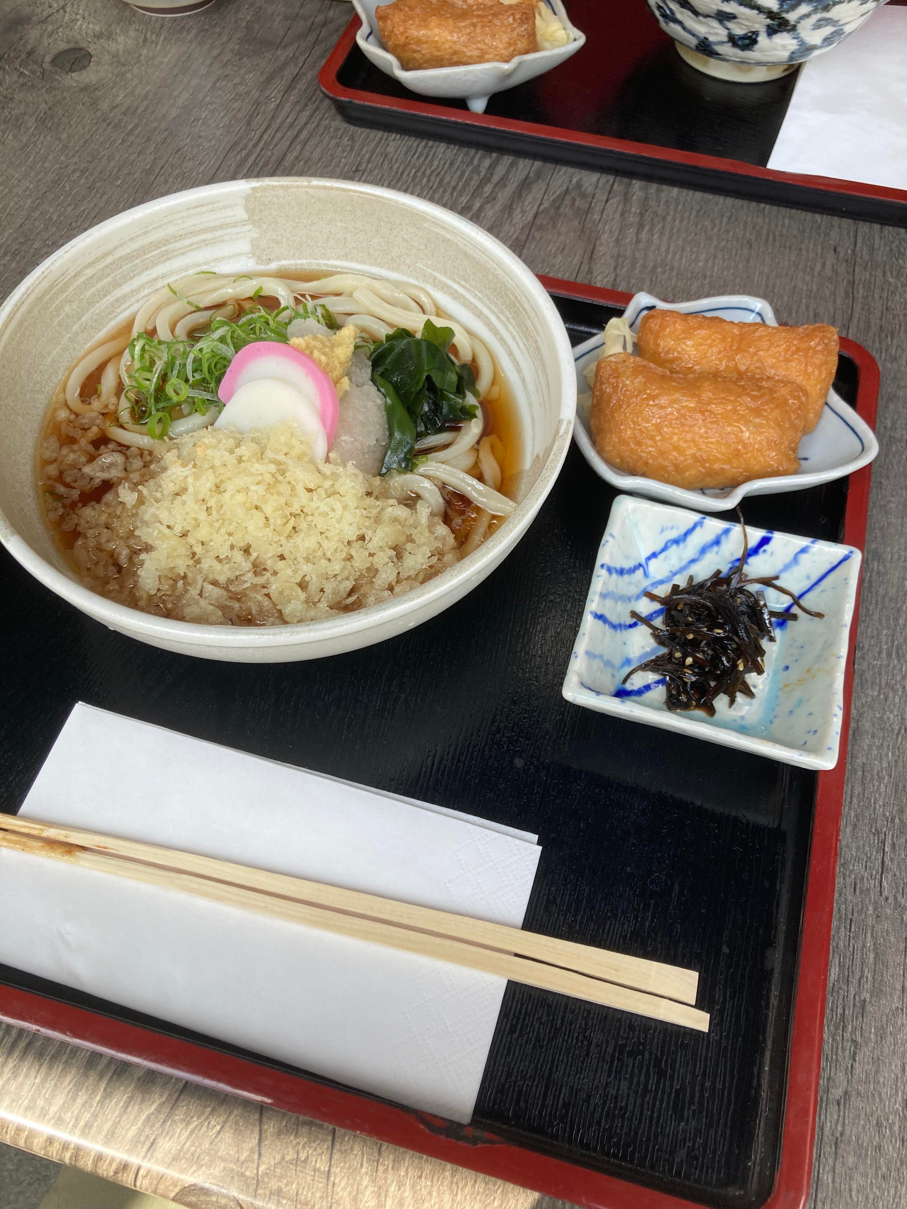 Cold Udon noodles with Tempura, Inari sushi and Wakame at an Isakaya in