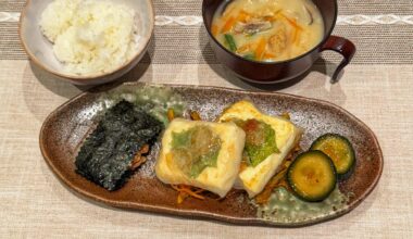Tofu wrapped in rice paper with prawns and shiso, natto wrapped in nori, spicy pickles, rice and miso soup.