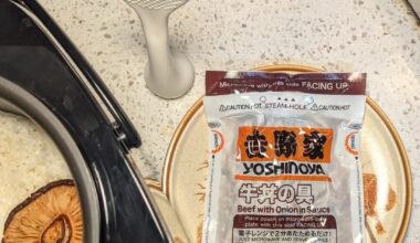 Yoshinoya Gyudon Onigiri with sesame seeds, green onions, mushrooms, and kimchi in Niigata grown koshihikari rice