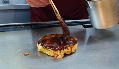 I really love sitting at the counter at an Okonomiyaki restaurant.