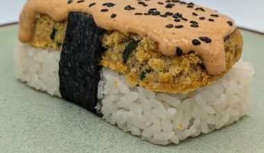 Tien Shinhan's tenshindon: snow crab omlette with teraoka sauce and green onions, nanatsuboshi rice, caramelized kimchi mayo, toasted nori, and black sesame seeds