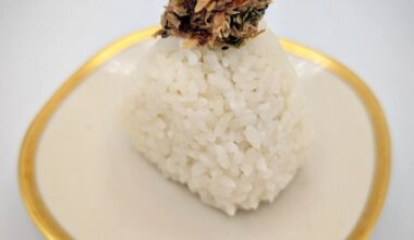 Fishwife Slow Smoked Mackerel with Chili Flakes with green onions, toasted sesame seeds, and additional chili flakes inside lightly salted Tamaki Gold steamed rice. Absolutely delicious!