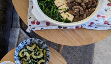 Beef, tofu & spinach nabe, pickles & egg yolk with seaweed salt