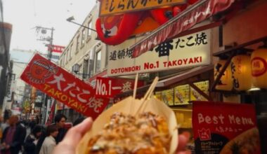 Enjoying the best tamoyaki at Dotonbori. These savory balls are a must try when you’re in Osaka