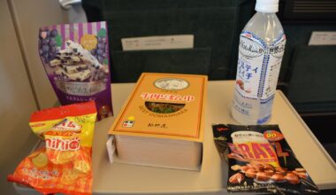 Yamagata's Domannaka ekiben and random combini snacks in a Tsubasa Shinkansen ride.