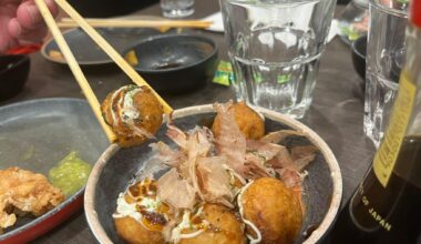 Takoyaki – crispy on the outside, gooey on the inside, topped with mayo, okonomiyaki sauce, and dancing bonito flakes