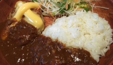 Hamburger steaks served with curry rice & salad