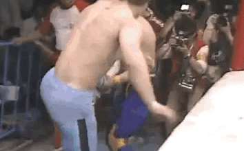 Dynamite Kid with an enzuigiri to Tiger Mask whose head bounces off the barricade.