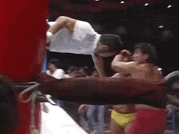 Great Muta sending Hiroshi Hase into the turnbuckle post!