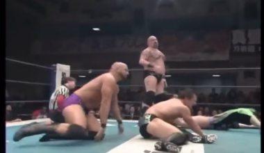 Finn Balor getting abused in a tag match by Giant Bernard & Karl Anderson while tag partner Taguchi is already knocked out of the ring