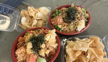 Couple of Poke bowls paired with Wonton chips