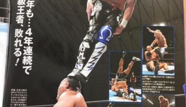 Kenny omega standing on ishiis head