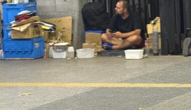 Homeless(?) foreigner under the bridge at Yurakucho station