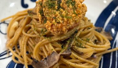 Wafu mushroom miso pasta topped with karage & aonori