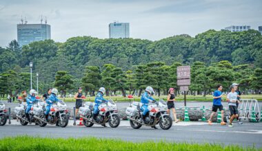 Police motorcade preparing to escort Emperor from the Imperial Palace to the Tokyo Station