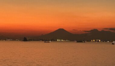 Mt. Fuji at dusk, with coastal traffic settling into the Yokohama–Tokyo approach.