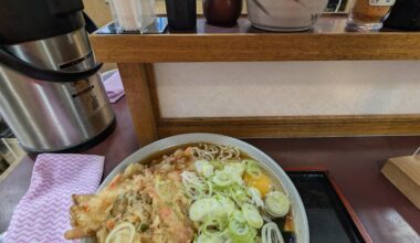 Standing eating soba