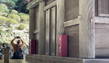 Modern safety inside a traditional wooden temple.