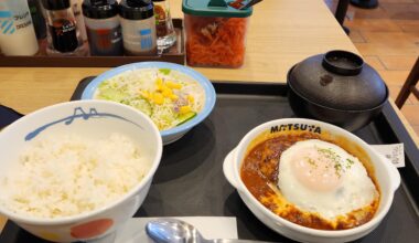Matsuya hamburger steak with egg and tomato sauce.