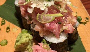 Torotaku Nokke Sushi(Minced fatty tuna (negitoro) on top of a takuan hosomaki (pickled daikon roll)