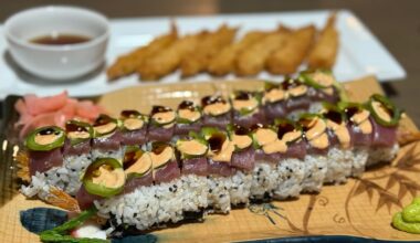 Newbie here… third day making sushi. Today I made a copycat roll from a local place. They call it the Rock & Roll: shrimp tempura, cream cheese, asparagus, topped with tuna, avocado, spicy mayo, sliced jalapeno, and eel sauce. It was so good!