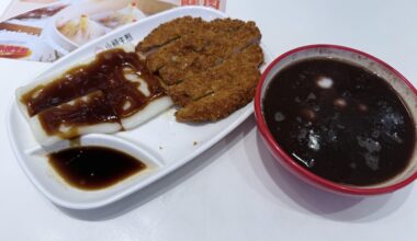 Tasting the famous food pork chop with rice cakes in the novel Blossoms Shanghai