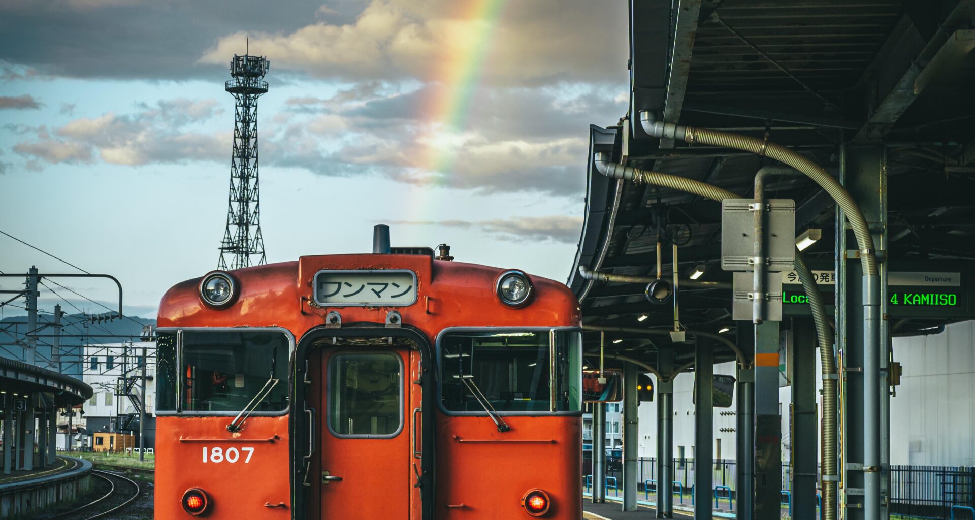 A rainbow over a local KiHa 40 train at Hakodate Station, Hokkaido.